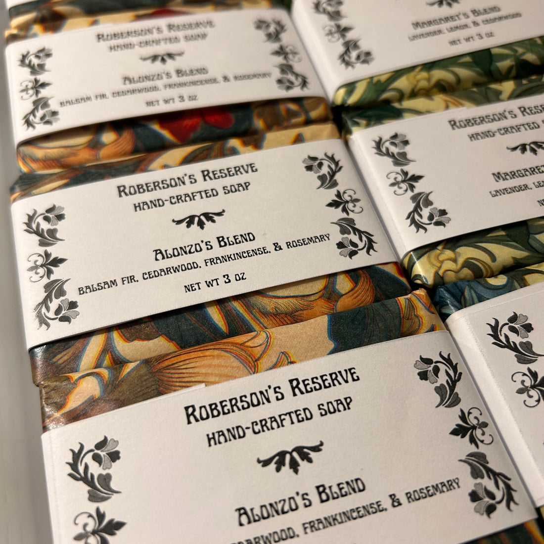 handmade bar soaps wrapped in art nouveau style paper packaging